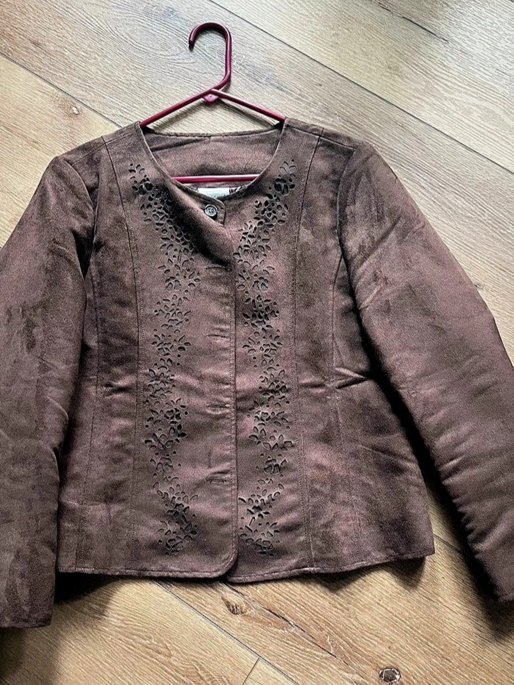 Brown jacket with button front and floral cutworks on front